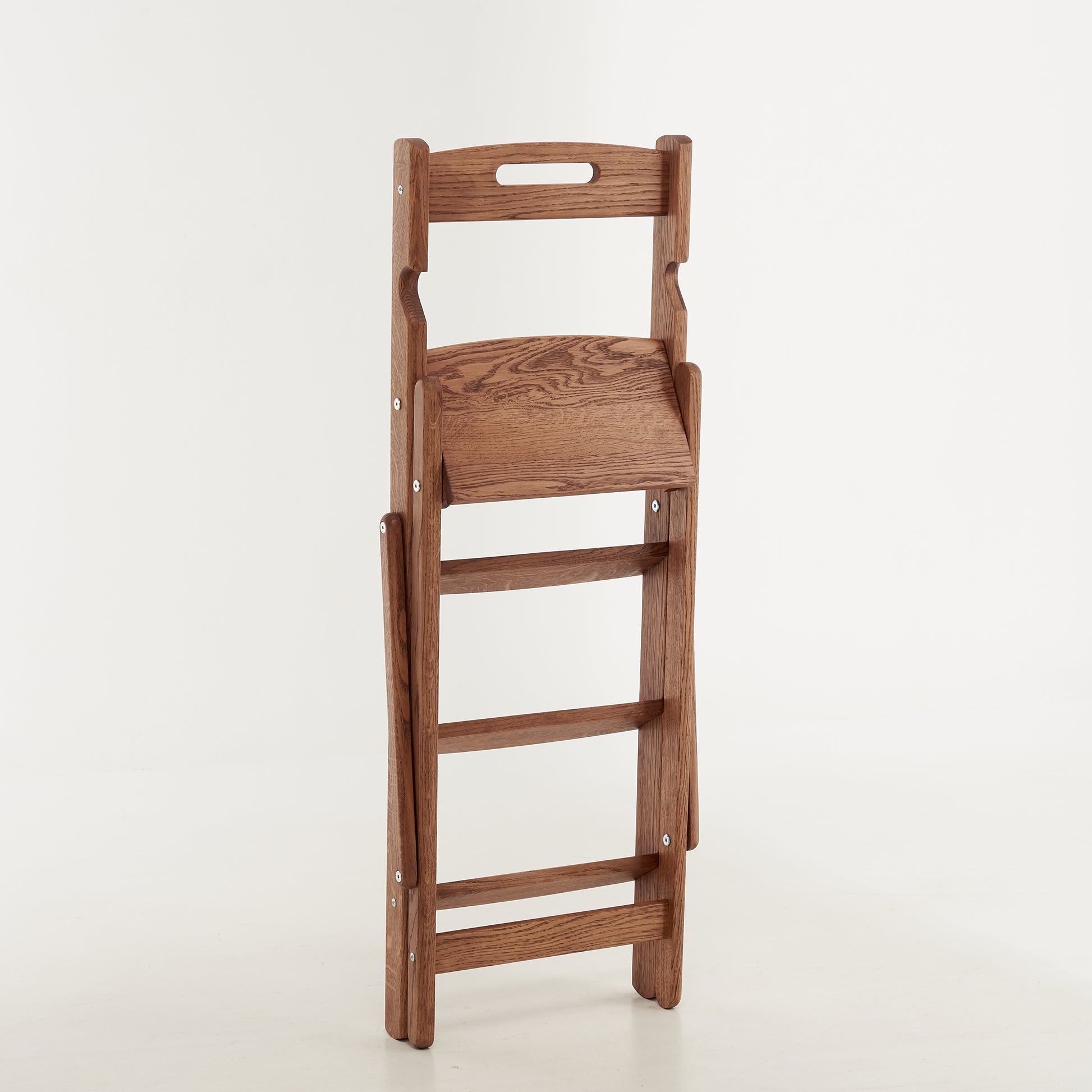 Folded oak ladder for easy storage in small spaces
