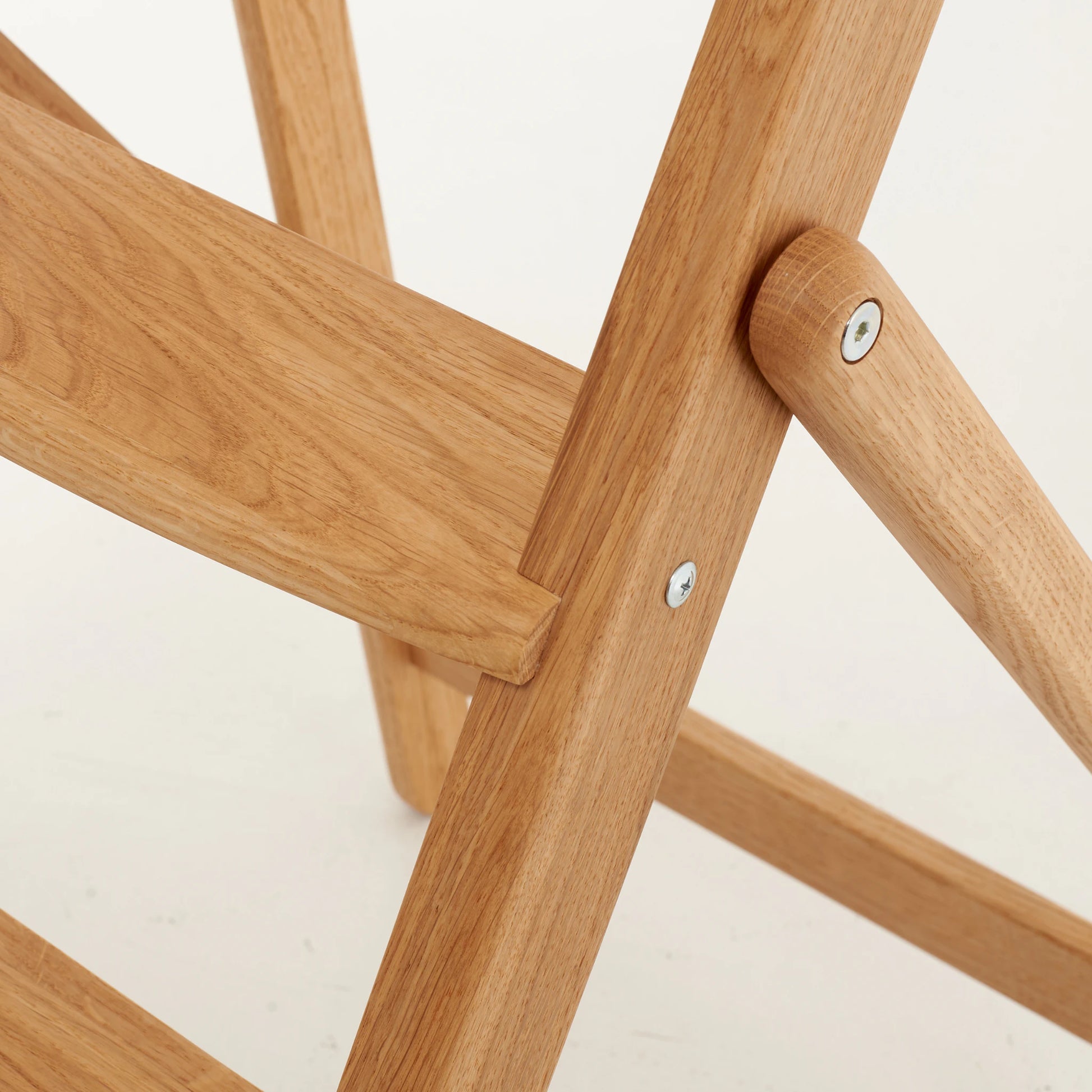 Joinery detail with pegs and screws on solid oak step ladder