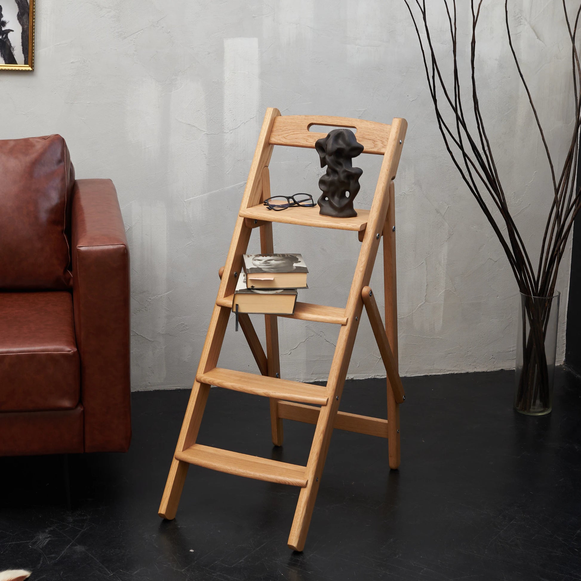 Oak ladder used as bookshelf or plant stand in living room