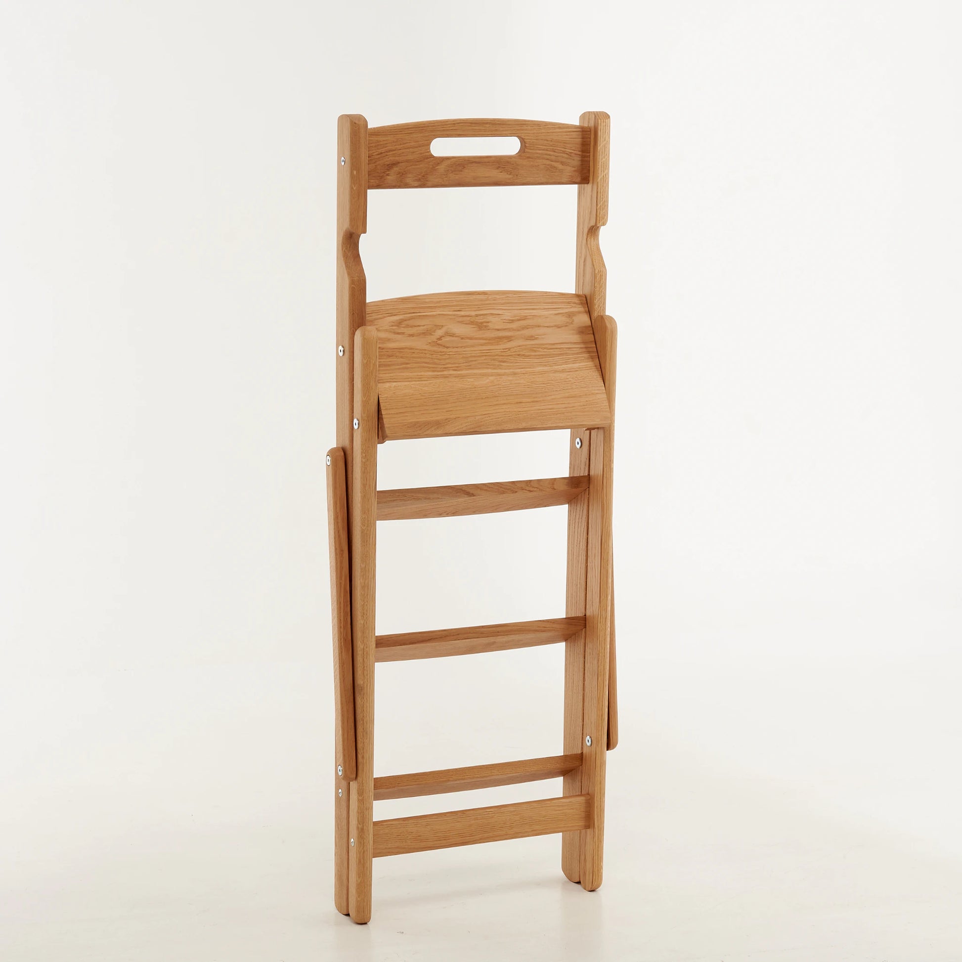 Folding oak step ladder in compact folded form