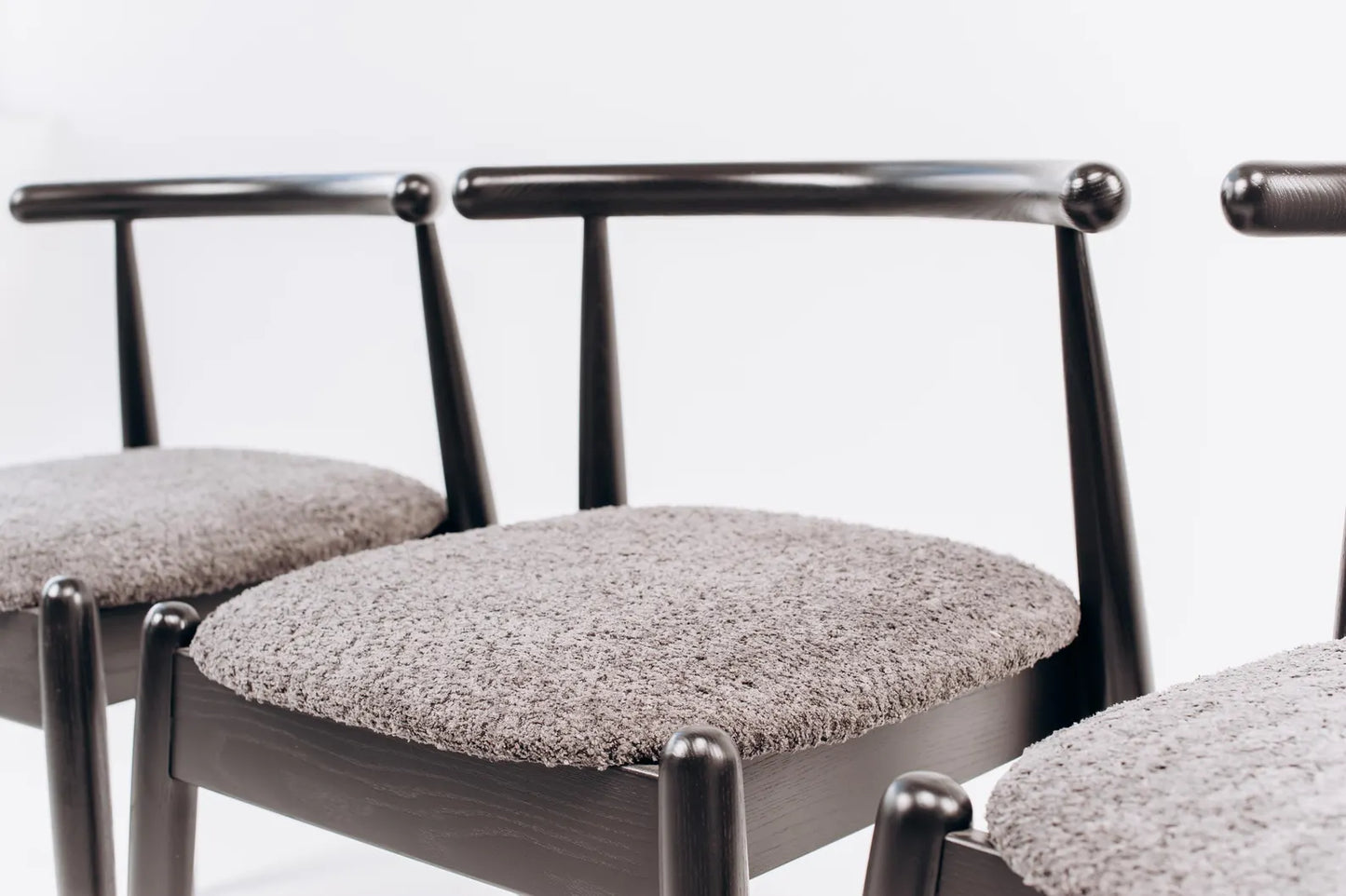 Black Solid oak dining chair with natural wood grain texture