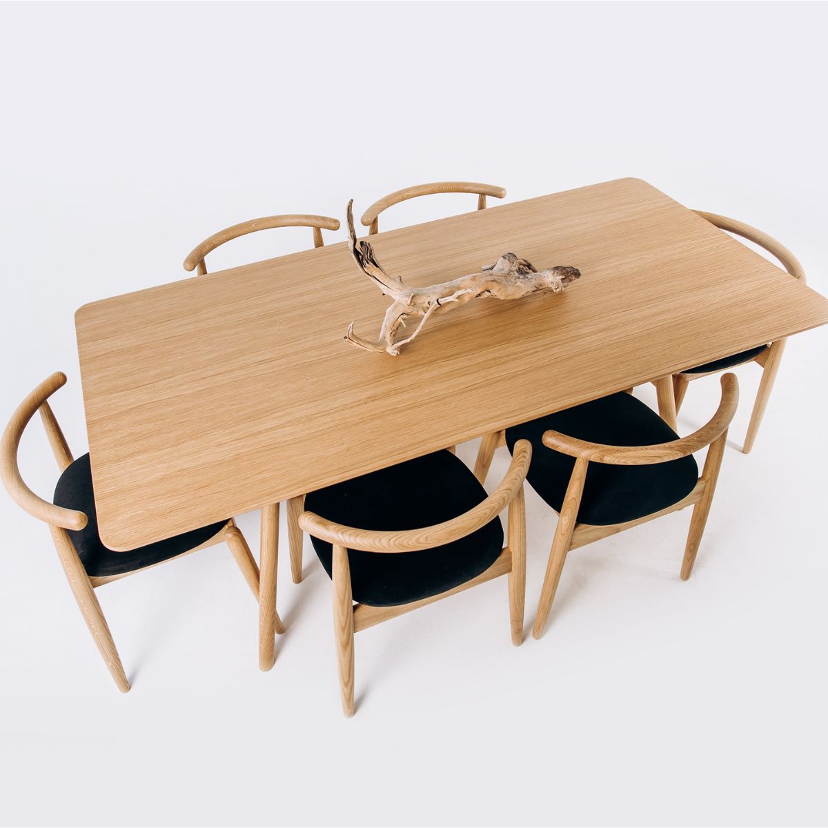 Light oak dining table surface showing natural wood grain texture