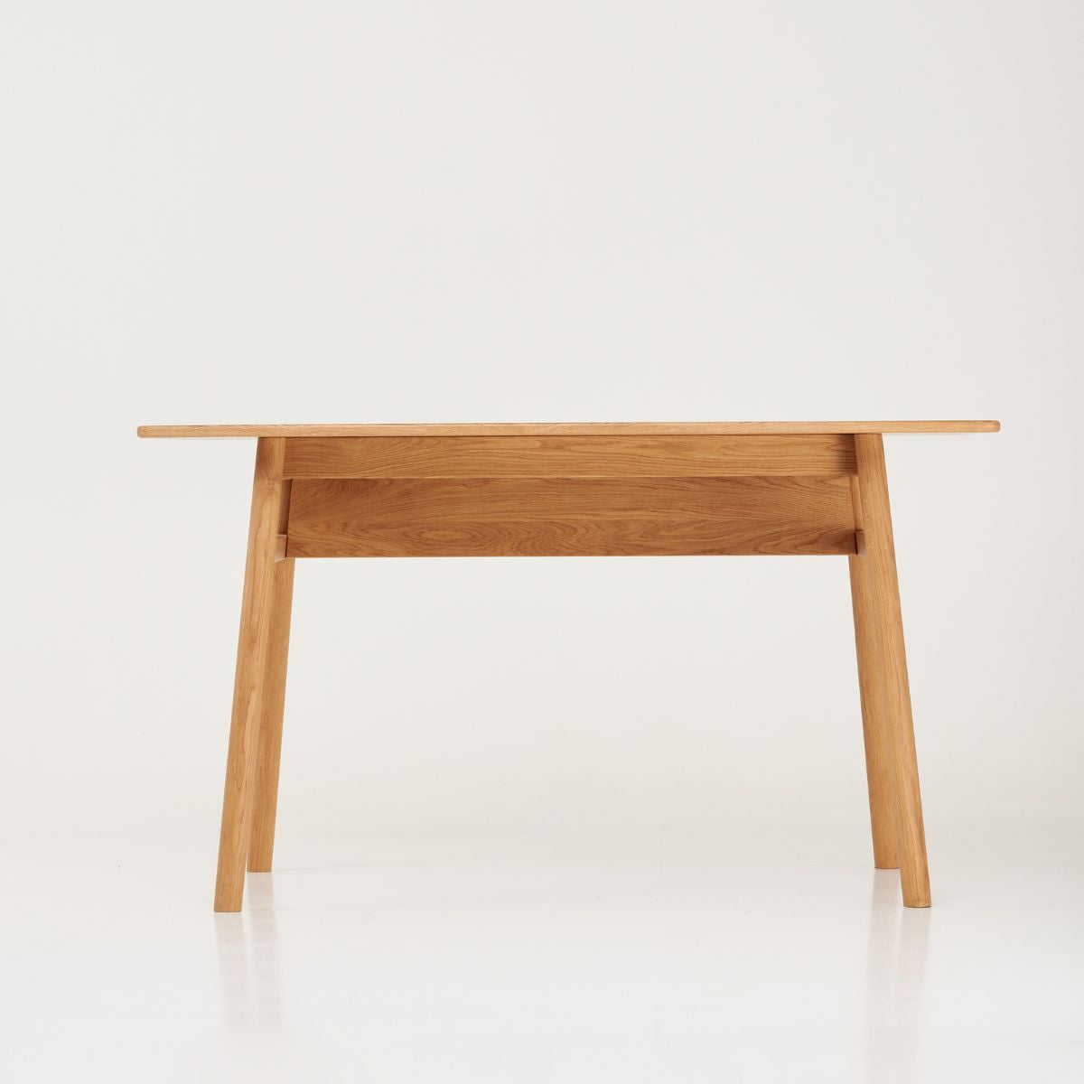Scandinavian minimalist writing desk side view on white background