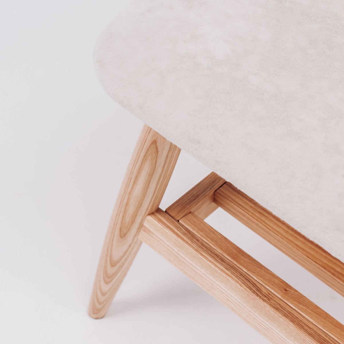 light oak bench with soft upholstered cushion